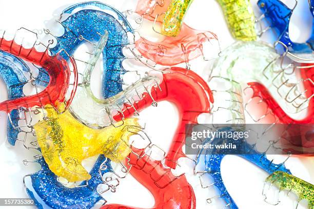 colorful braces studio shot - orthodontics stockfoto's en -beelden