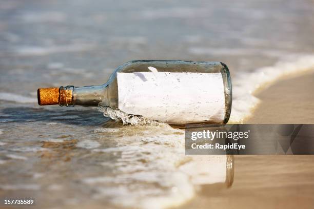 castaway note in bottle is blank:  you add your message - message in a bottle stock pictures, royalty-free photos & images