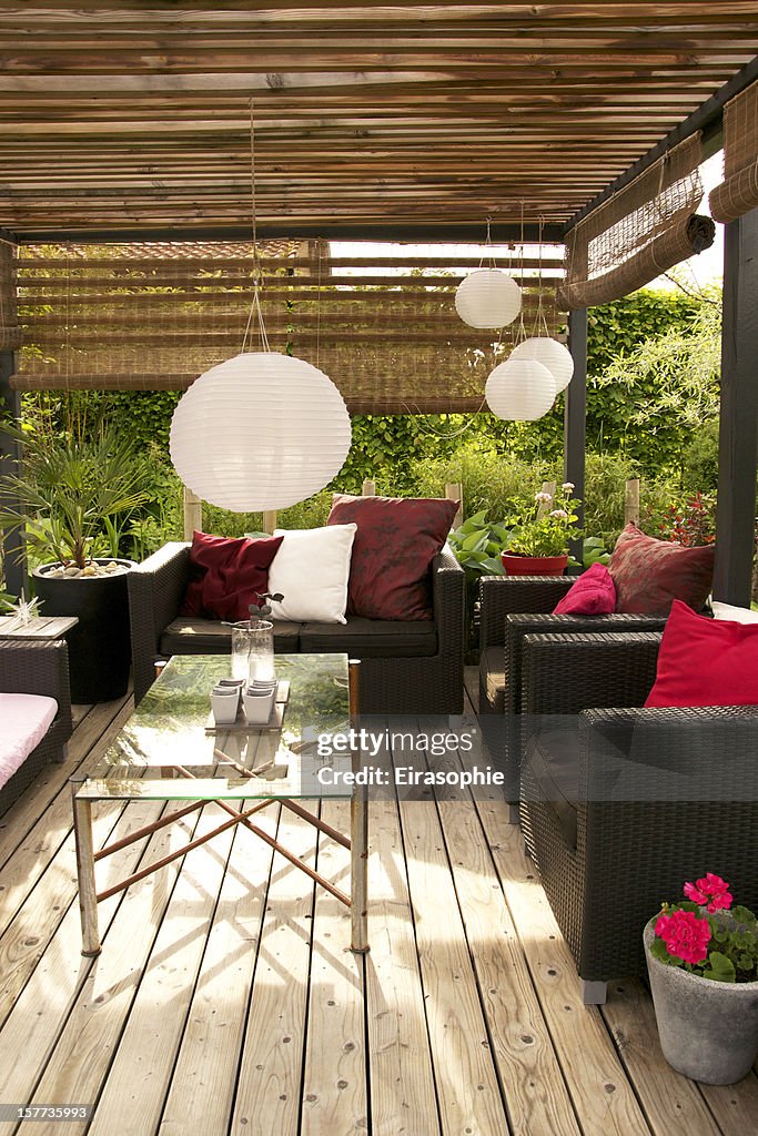 Patio with a pergola and modern outdoor furniture