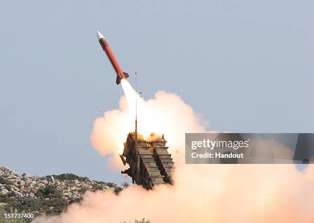 In this handout image provided by the German Bundeswehr armed forces a patriot missile is fired during the Operation Red Arrow exercise on October...