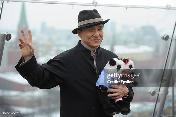 Jackie Chan poses during a photocall for the Russian premiere of 'Armour of God 3' on the roof of the Ritz Carlton Hotel on December 6, 2012 in...