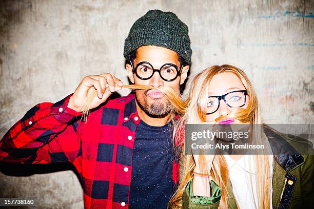 portrait of two young people pulling funny faces - different cultures stock pictures, royalty-free photos & images