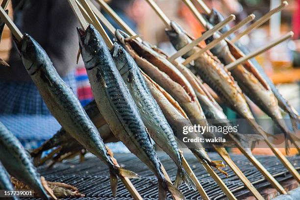 steckerlfisch - grilled fish on octoberfest - forelle pear stock pictures, royalty-free photos & images