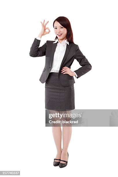 アジア ok の標識を示すビジネスウーマンに白背景 - okサイン　女性 ストックフォトと画像