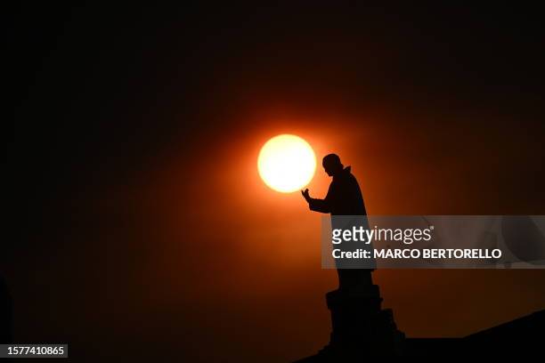 Statue in the Sanctuary of Our Lady of Fatima is pictured at daybreak in Fatima, before the visit of Pope Francis, on August 5, 2023. Around one...