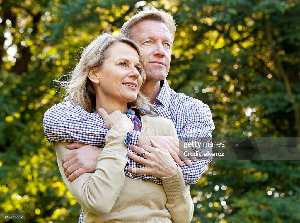 Man holding his wife tightly in love