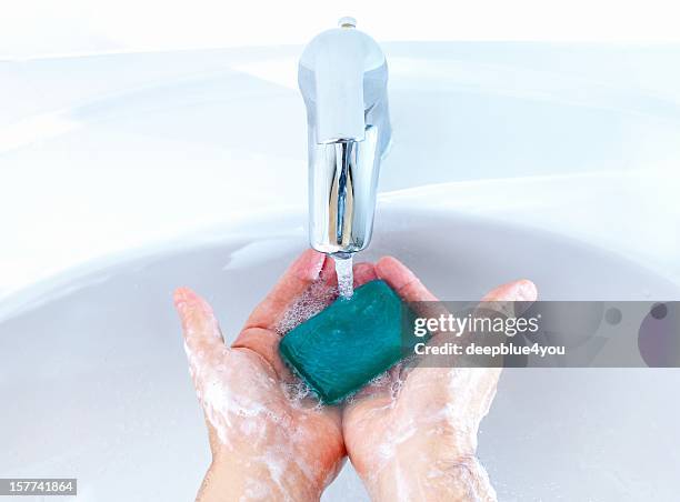 woman washing her hands - bar soap stock pictures, royalty-free photos & images