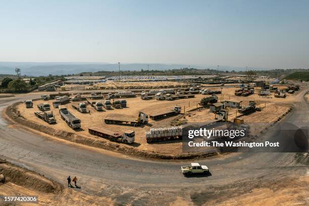 Trucks load sacks containing carbon hydroxide at the Tenke Fungurume industrial mine, one of the world's largest copper-cobalt mines, in Lualaba...