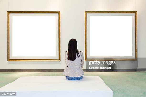 one woman looking at white frame in an art gallery - fine art painting stock pictures, royalty-free photos & images