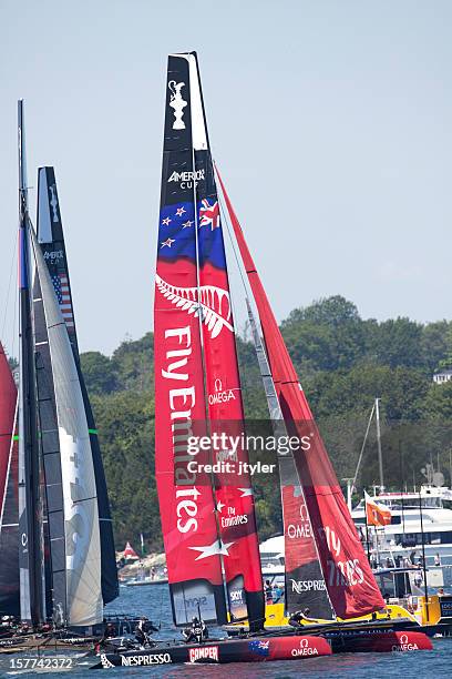 sailing catamarans preparing for an america's cup race - racing catamaran stock pictures, royalty-free photos & images