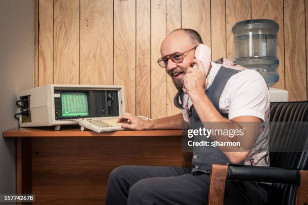 happy 1980's computer worker nerd  on phone at cubicle - 1980 office stock pictures, royalty-free photos & images