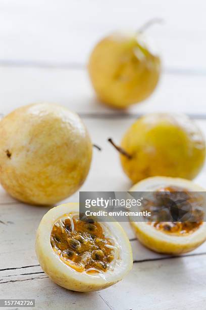 passion fruit on a table. - passionfruit stock pictures, royalty-free photos & images