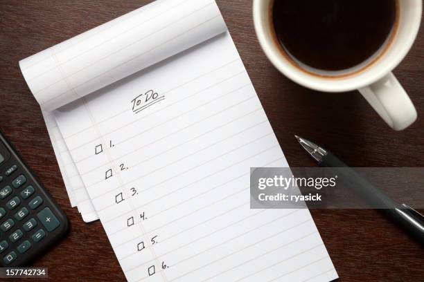 blank to do list notepad on desk from above - liste stock pictures, royalty-free photos & images