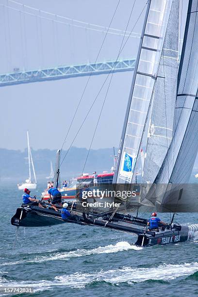 racing  catamaran yacht in a  balancing maneuve - catamaran stock pictures, royalty-free photos & images