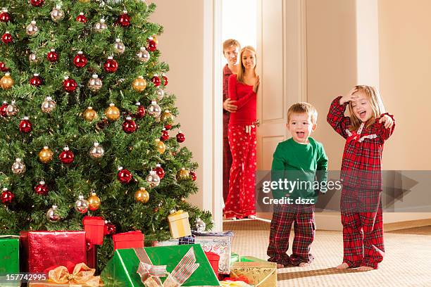 christmas morning family - christmas tree close up stock pictures, royalty-free photos & images