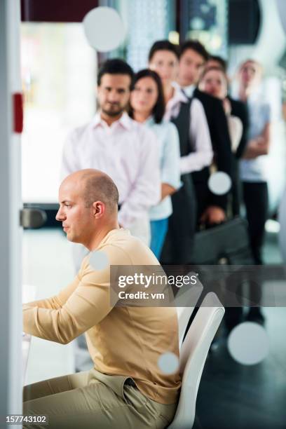 group of people waiting in line - bank counter stock pictures, royalty-free photos & images