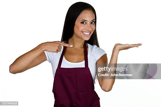 cheerful waitress pointing to copy space - apron isolated stock pictures, royalty-free photos & images