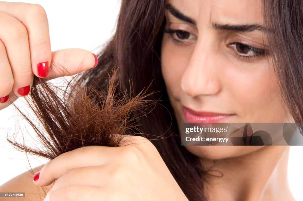 Woman trying to clean up her hair