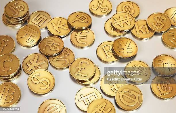 gold international currency coins - geldwechsel stock-fotos und bilder