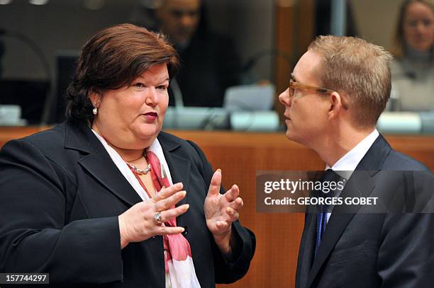 Belgium State Secretary for Migration and Asylum Policy Maggie De Block and Swedish Minister of Migration and Asylum Policy Tobias Billstrom talk...