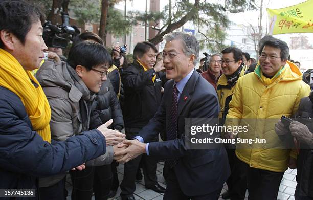 Moon Jae-In, presidential candidate of the main opposition Democratic United Party takes to downtown streets as he begins his presidential election...