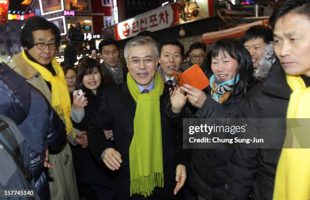 Moon Jae-In, presidential candidate of the main opposition Democratic United Party takes to downtown streets as he begins his presidential election...