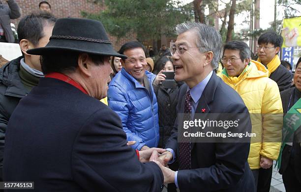 Moon Jae-In, presidential candidate of the main opposition Democratic United Party takes to downtown streets as he begins his presidential election...