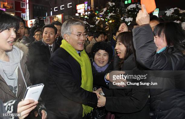 Moon Jae-In, presidential candidate of the main opposition Democratic United Party takes to downtown streets as he begins his presidential election...