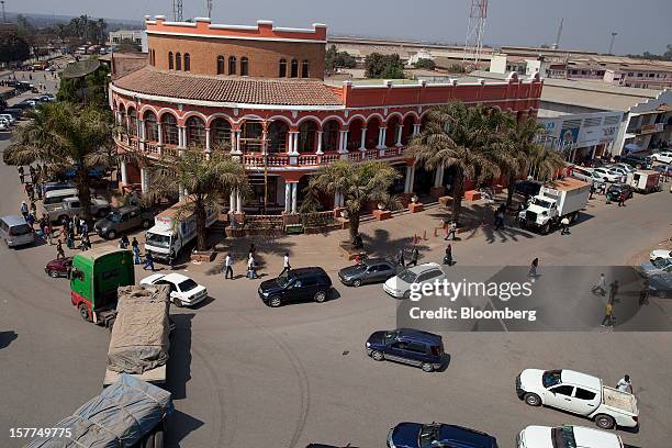 Pedestrians, vehicles and trucks are seen on a main street in central Lubumbashi, Democratic Republic of Congo, on Tuesday, July 31, 2012. Israeli...