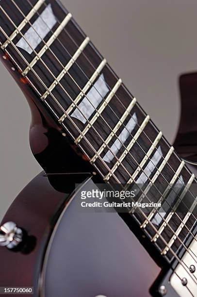 The fretboard with trapezoid inlays of a Fret-King Black Label Eclat Standard electric guitar, photographed during a studio shoot for Guitarist...