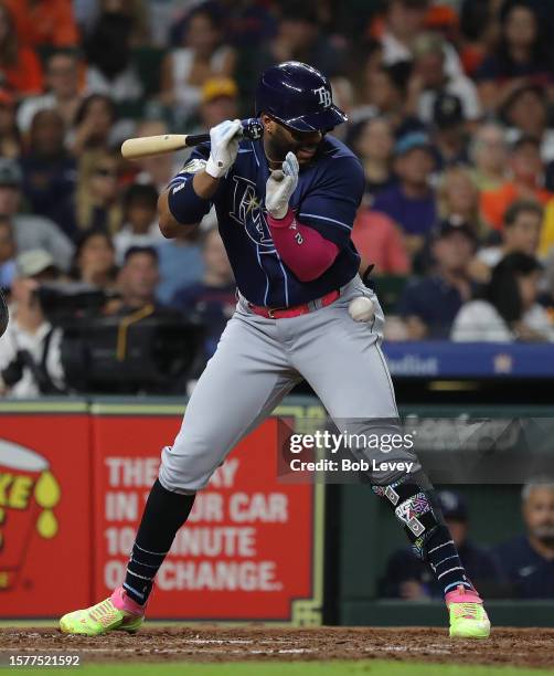 Yandy Diaz of the Tampa Bay Rays is hit by a pitch in the seventh inning against the Houston Astros at Minute Maid Park on July 28, 2023 in Houston,...