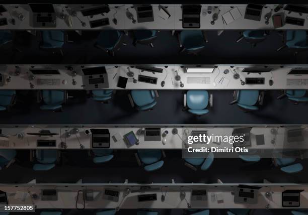 empty, dark office, with one computer on - silla de oficina fotografías e imágenes de stock