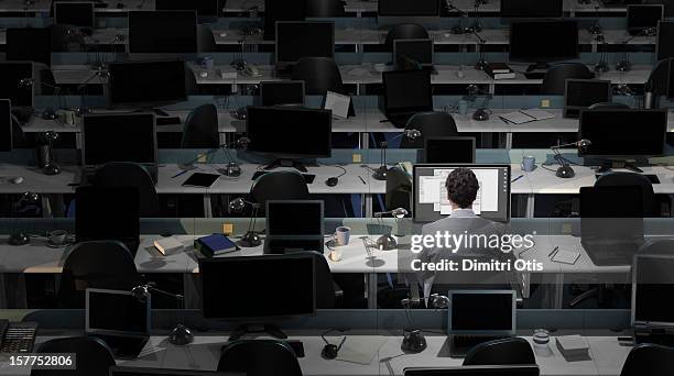 an office worker sits working in an empty office - bar bildbanksfoton och bilder