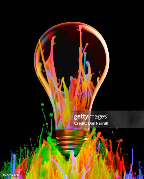 colorful ideas - light bulb fotografías e imágenes de stock