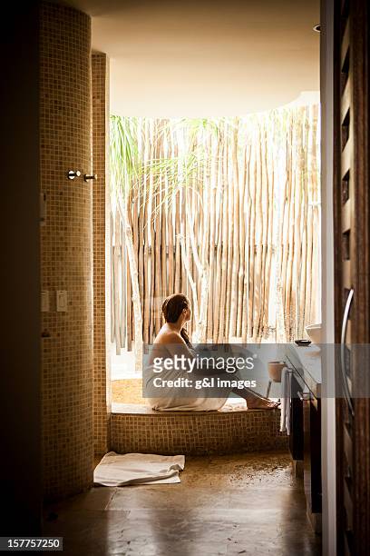 woman relaxing in spa bathroom - bathrobe stock-grafiken, -clipart, -cartoons und -symbole