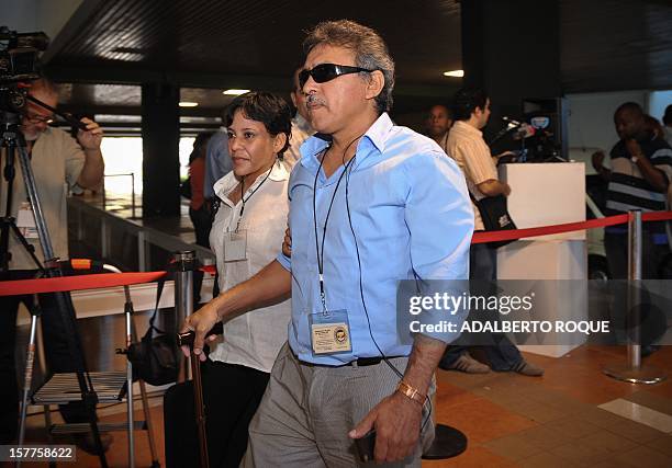 Members of FARC-EP leftist guerrillas delegation commander Jesus Santrich and guerrilla fighter Maritza Garcia arrive at the Convention Palace in...