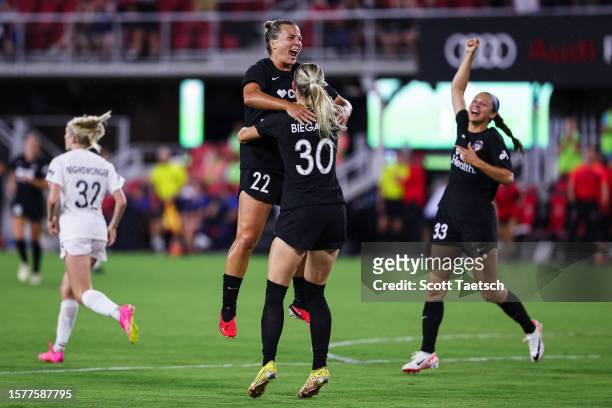 Camryn Biegalski of Washington Spirit celebrates with Amber Brooks and Ashley Hatch after scoring a goal against the NJ/NY Gotham FC during the...