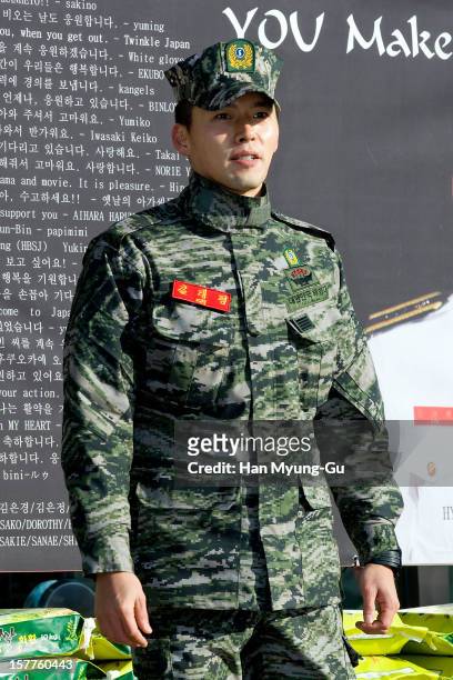 Actor Hyun Bin poses for photographs after being discharged from military service on December 6, 2012 in Gyeonggi-do, South Korea.