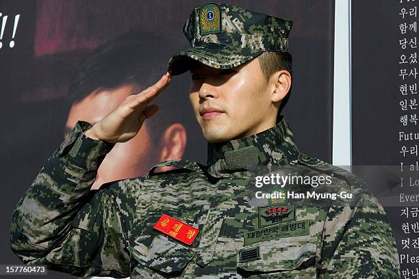 Actor Hyun Bin poses for photographs after being discharged from military service on December 6, 2012 in Gyeonggi-do, South Korea.