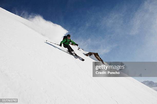 skier downhill - freestyle skiing stock pictures, royalty-free photos & images