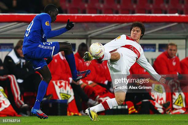 Pape Pate Diouf of Molde is challenged by Gotoku Sakai of Stuttgart during the UEFA Europa League group E match between VfB Stuttgart and Molde FK at...