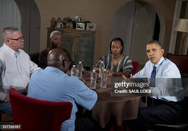 President Barack Obama speaks about extending middle class tax cuts and the fiscal cliff alongside Tiffany Santana , Richard Santana , Velma...