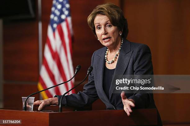 House Minority Leader Nancy Pelosi answers reporters' questions during her weekly news conference at the U.S. Capitol Visitors Center December 6,...