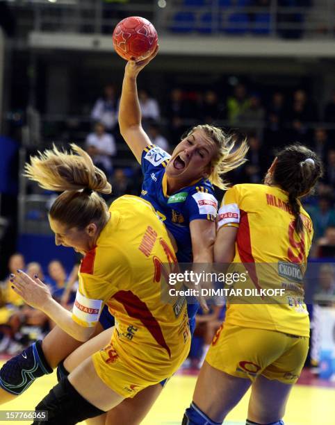 Sweden's Isabelle Gullden vies with Macedonia's Julija Nikolic and Natasha Mladenovska during the Women's EHF Euro 2012 Handball Championship match...