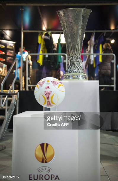 Picture taken on December 6, 2012 shows the UEFA Europa League official trophy set up in front of the Europa League truck parked outside the stadium...