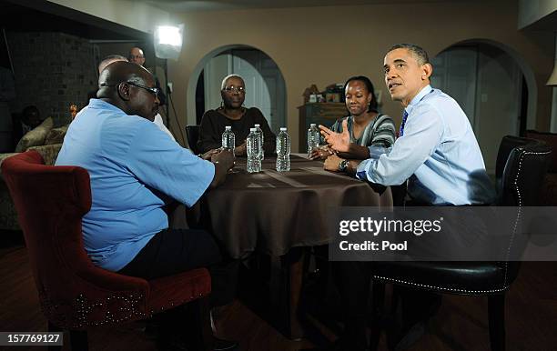 President Barack Obama speaks while visiting a home to discuss his plan to extend tax cuts for 98 percent of Americans December 6, 2012 in Falls...