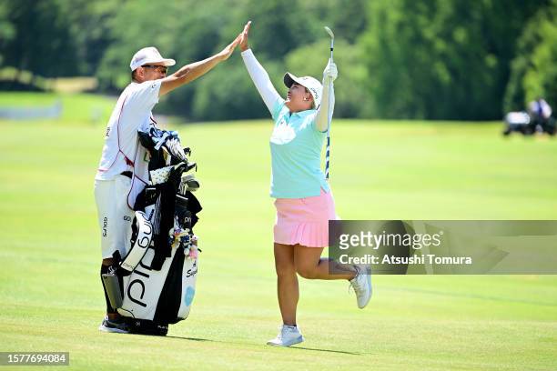 Ai Suzuki of Japan celebrates after making her eagle on the 18th hole during the third round of Rakuten Super Ladies at Tokyu Grand Oak Golf Club on...