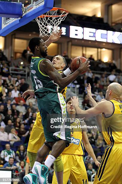 James Gist, #15 of Unicaja Malaga competes with Sven Schultze, #6 of Alba Berlin during the 2012-2013 Turkish Airlines Euroleague Regular Season Game...