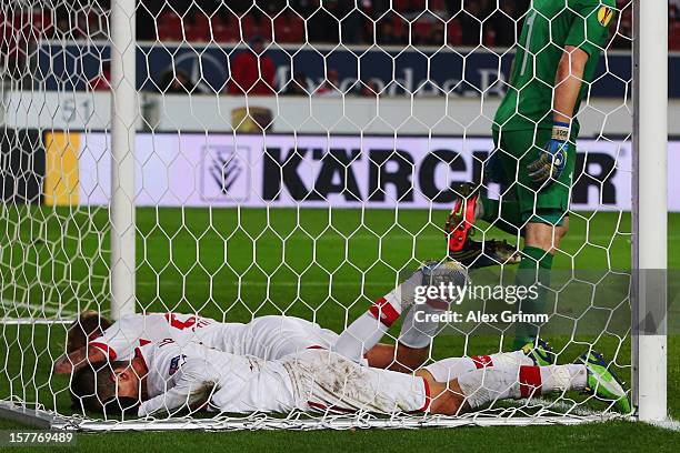 Vedad Ibisevic and Raphael Holzhauser of Stuttgart react after missing a chance to score during the UEFA Europa League group E match between VfB...