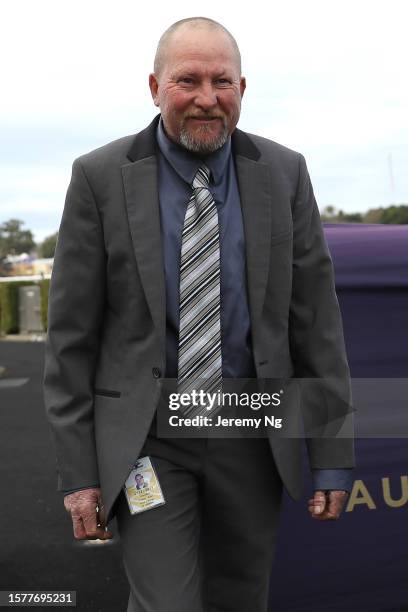 Trainer Scot Collings embrace with Nick Heywood riding Mogo Magic after winning Race 7 Godolphin Lifetime Care during Industry Celebration Racing for...